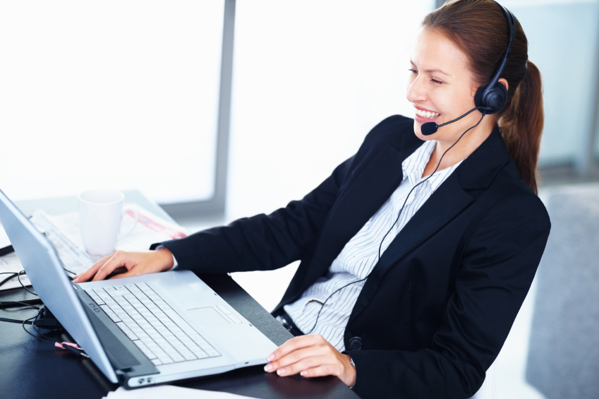 Happy business woman speaking on the phone.
