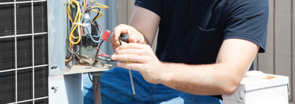 Technician working on an HVAC unit