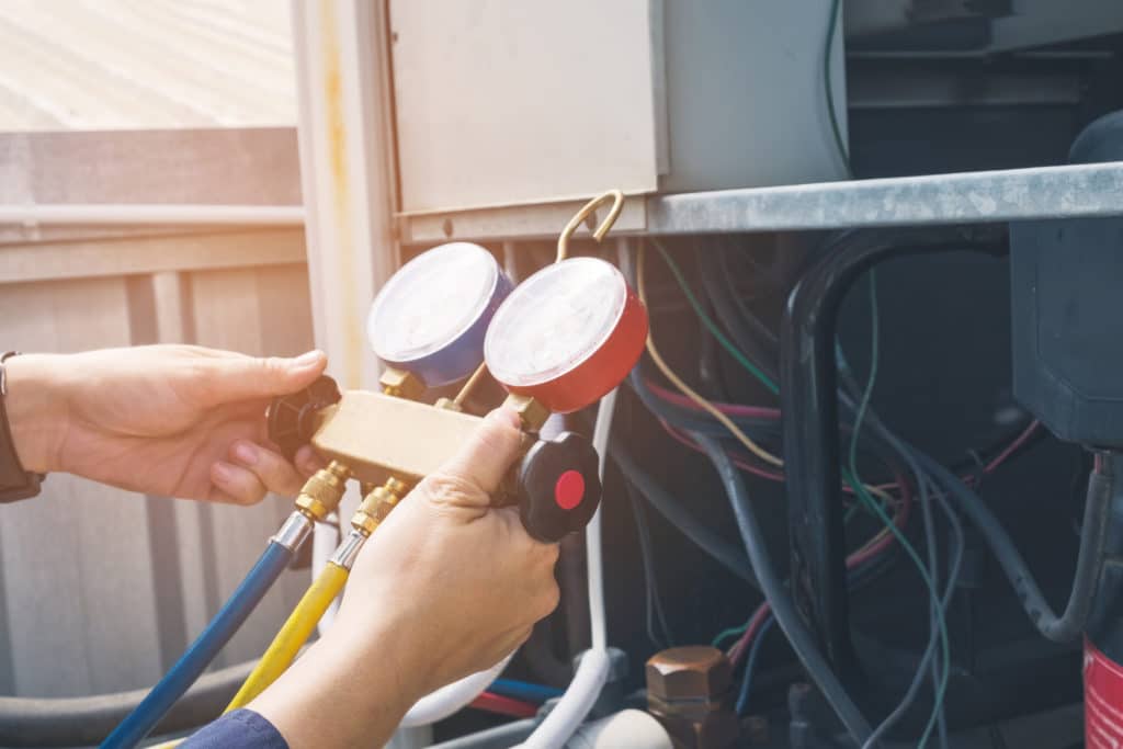 Technician is checking air conditioner