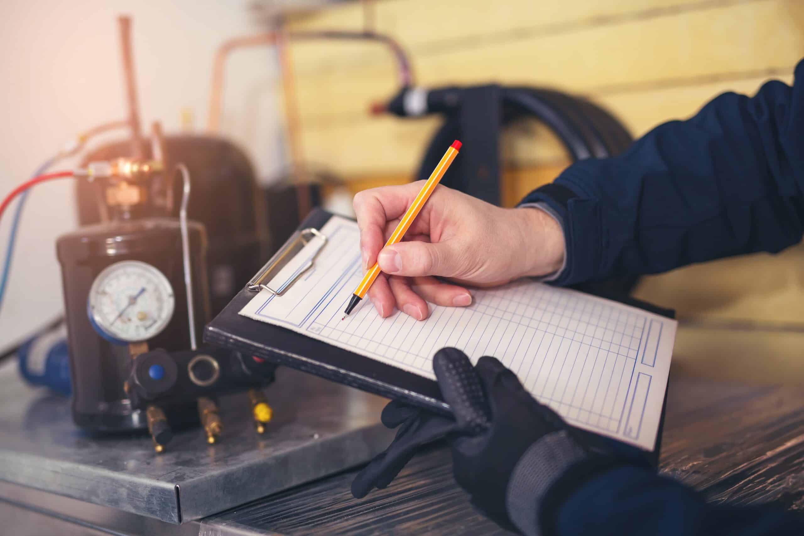 HVAC technician with checklist