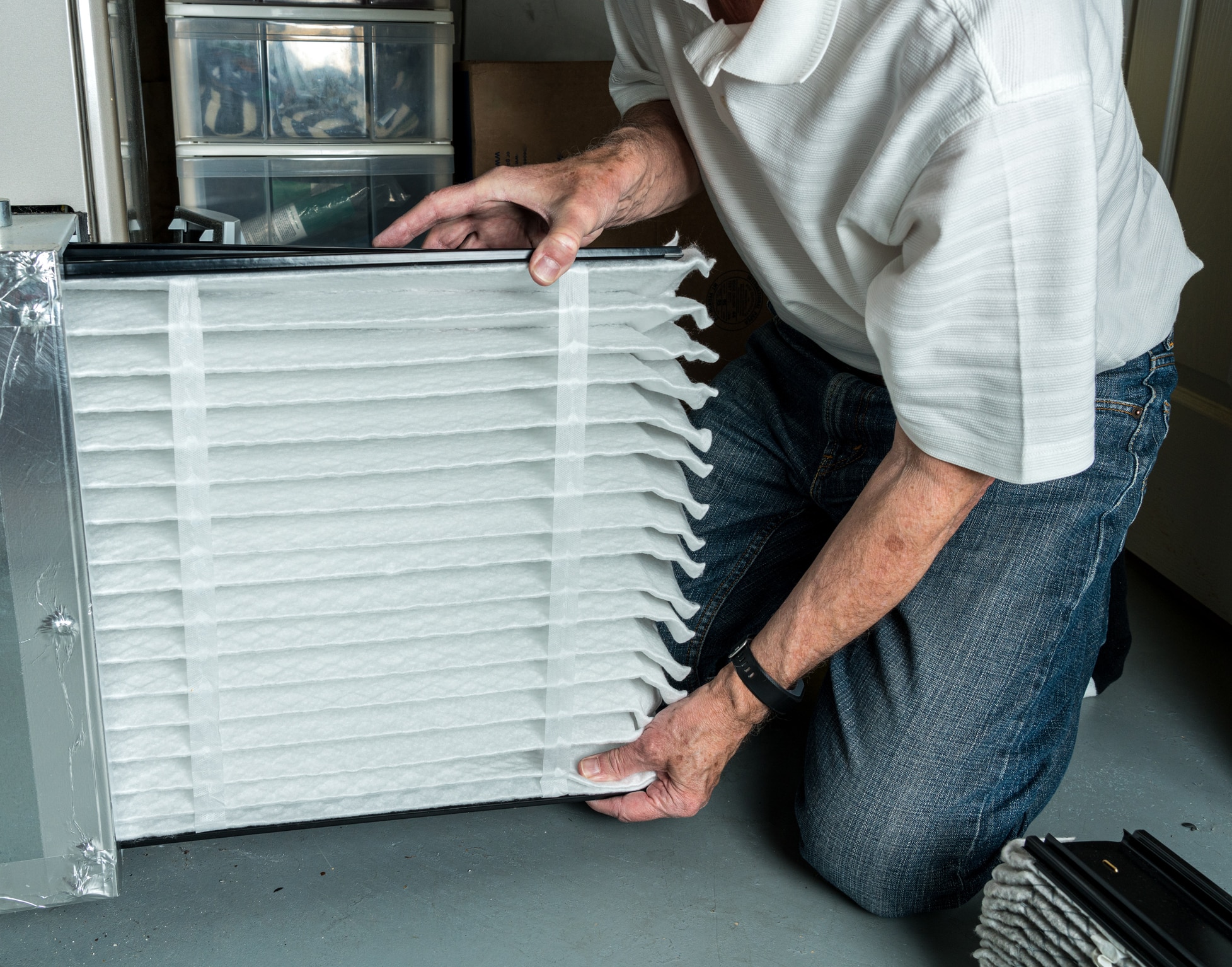 Changing air filter during furnace maintenance