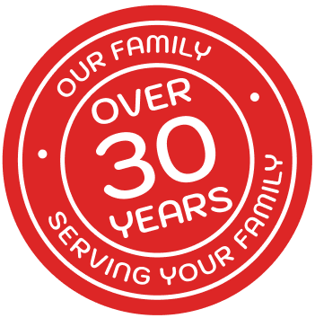 Red circular badge with white text reading 'Over 30 years' and 'Our family serving your family' around the edge.