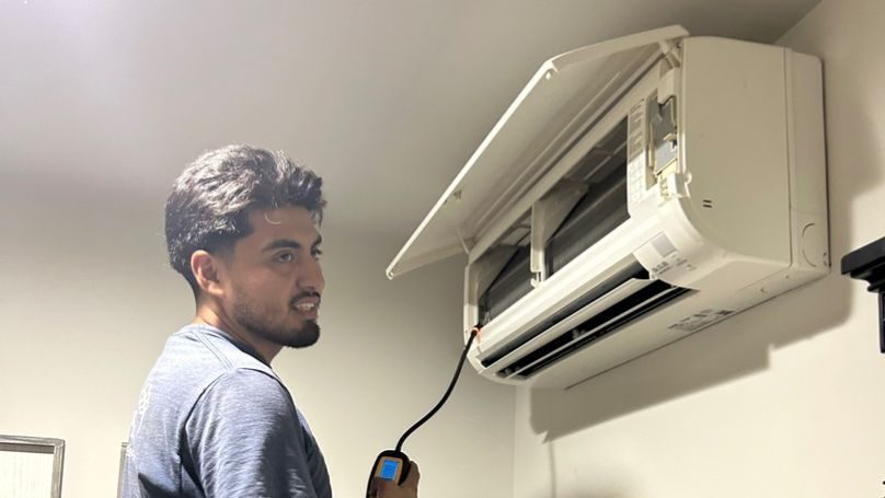 Ductless mini split being installed