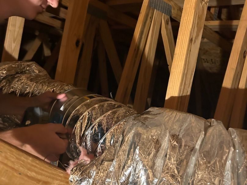Parker's tech repairing ductwork.