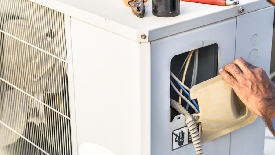 An open heat pump being serviced.