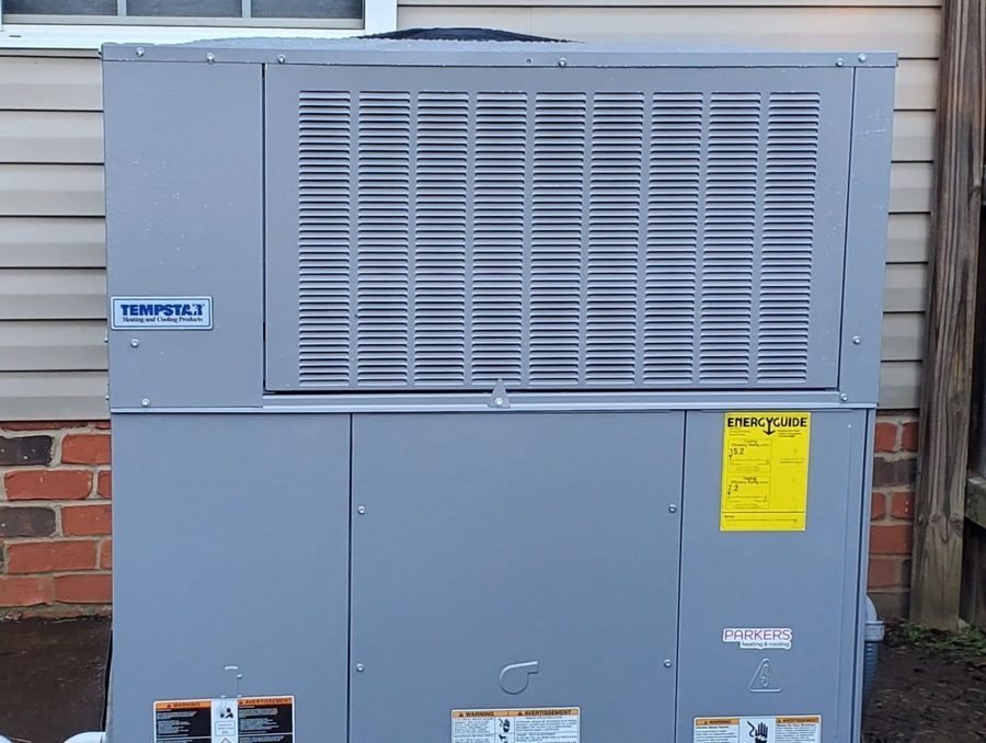 HVAC unit outside home during heating service.
