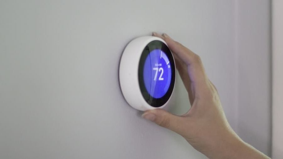 Smart thermostat on the wall.